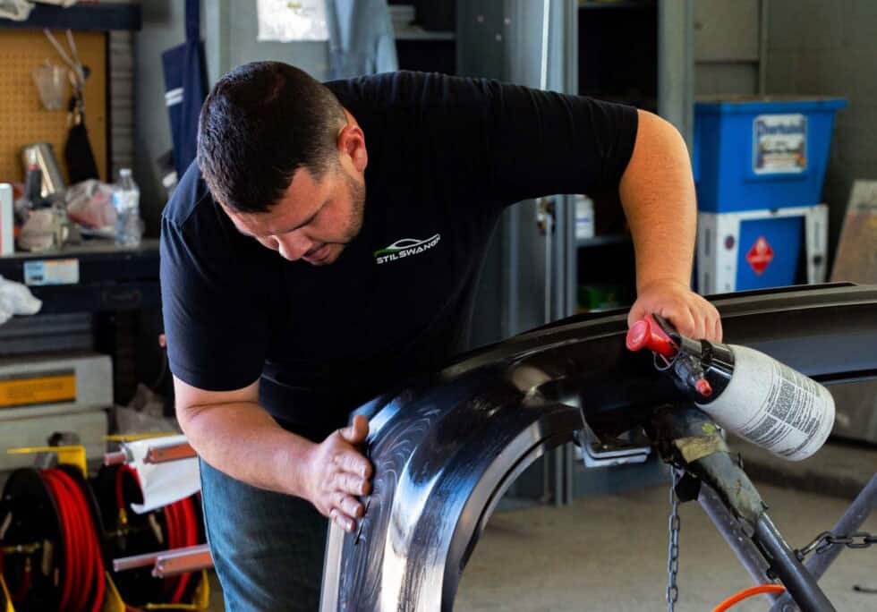 Auto Body Repair Tech fixing Fender